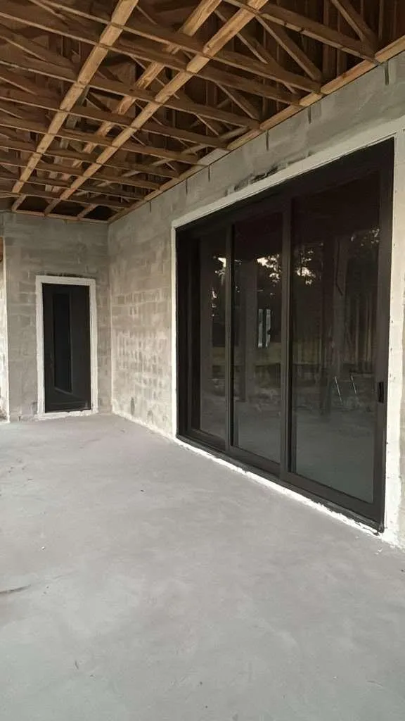 Residential 3-panel impact sliding glass door dark frame