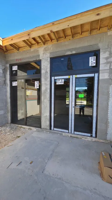 Commercial impact storefront double doors with sidelights installation