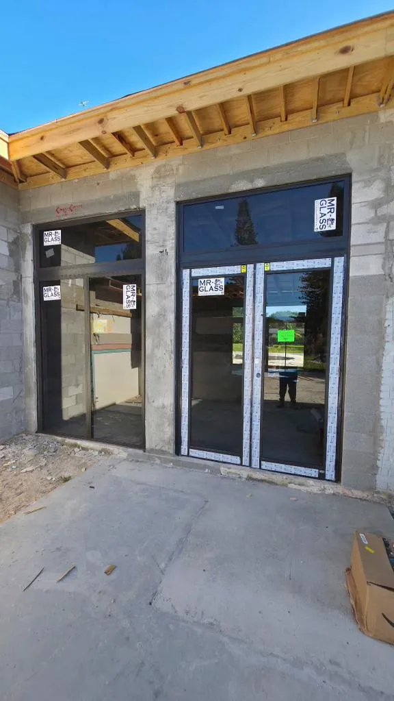 Commercial impact storefront double doors with sidelights installation