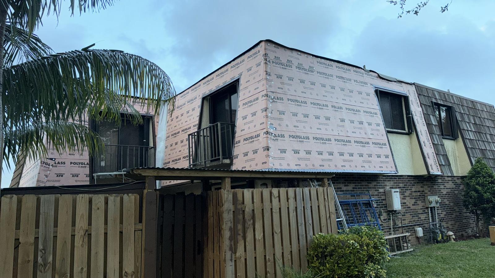 Roof replacement progress Palm Springs FL - old shingles removed